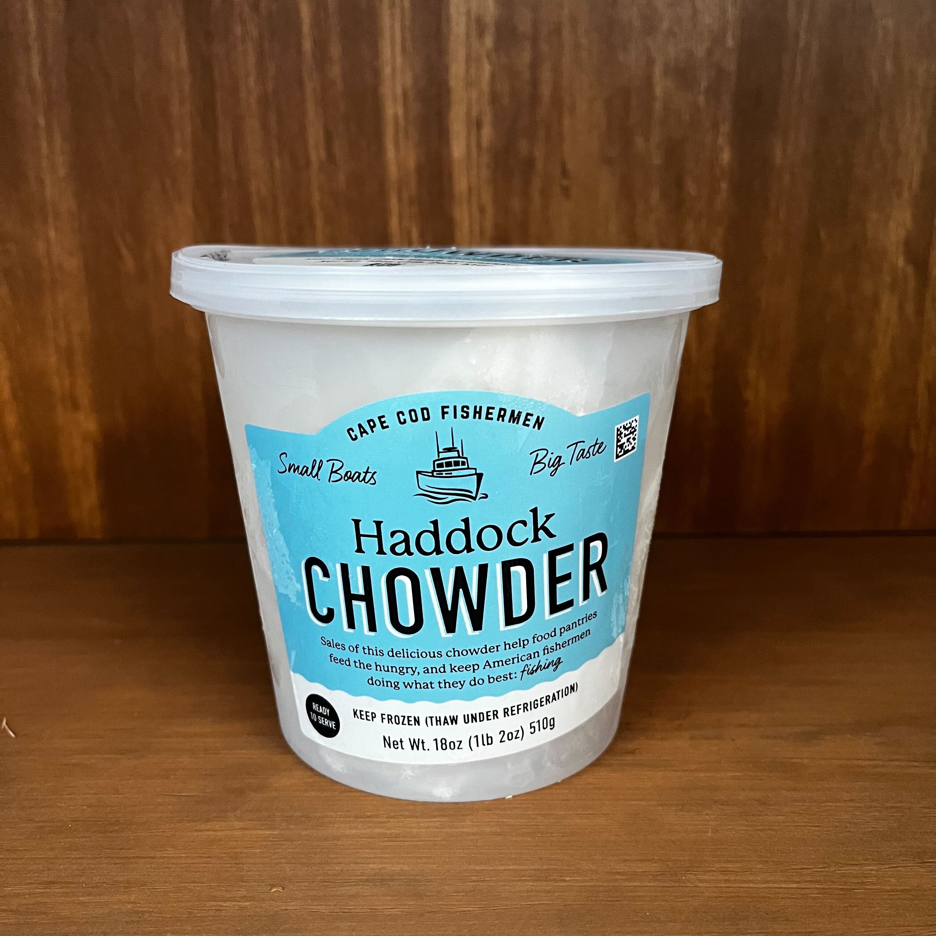 Container of Haddock Chowder on a wooden surface