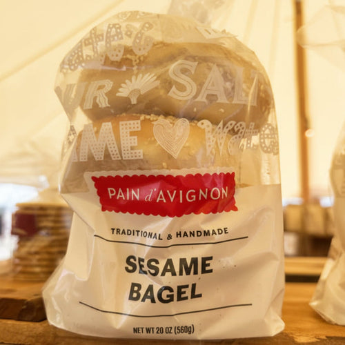Bagel package with 'Pain d'Avignon' branding on a wooden surface.